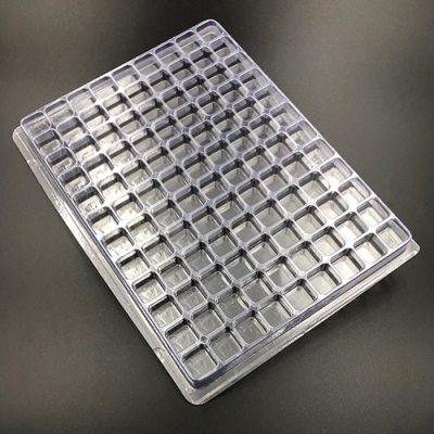 Plastic shipping tray with 0.75" cavities.