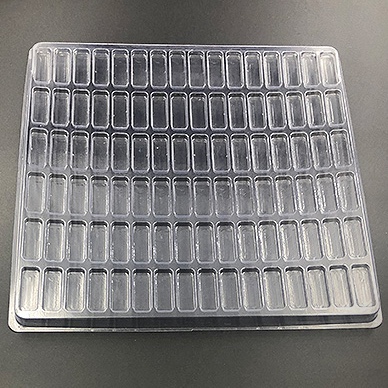 Plastic shipping tray with 1.56" cavities.