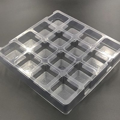 Plastic shipping tray with 2.13" square cavity.