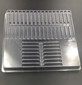 Plastic shipping tray with 5.55" cavities.