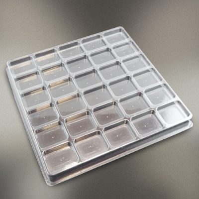 Plastic shipping tray with 2.25" cavities.